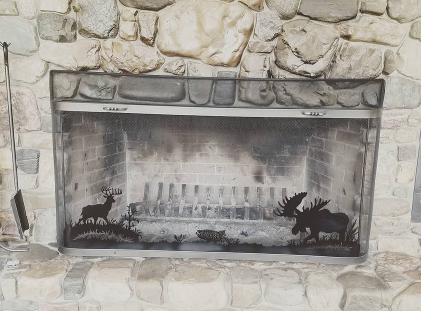 Custom wildlife fireplace screen