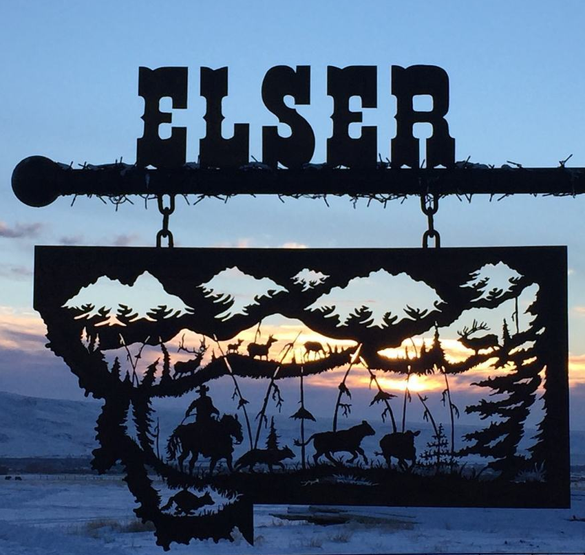 Custom ranch metal sign at sunset